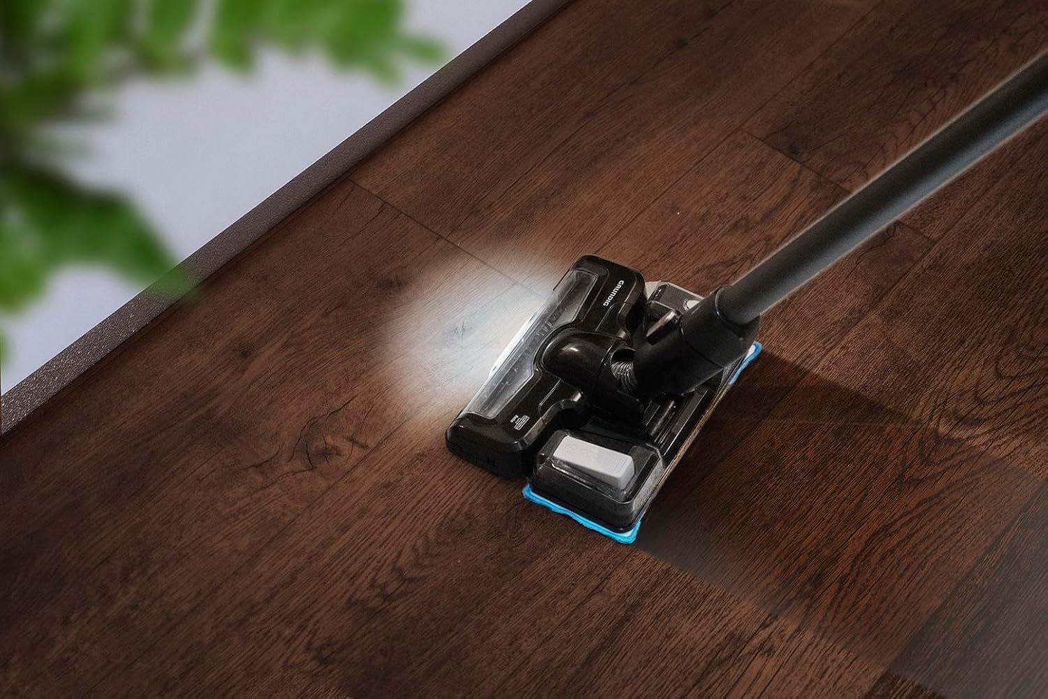 GRUNDIG VCP 5030 floor brush with LED lights on a wooden floor