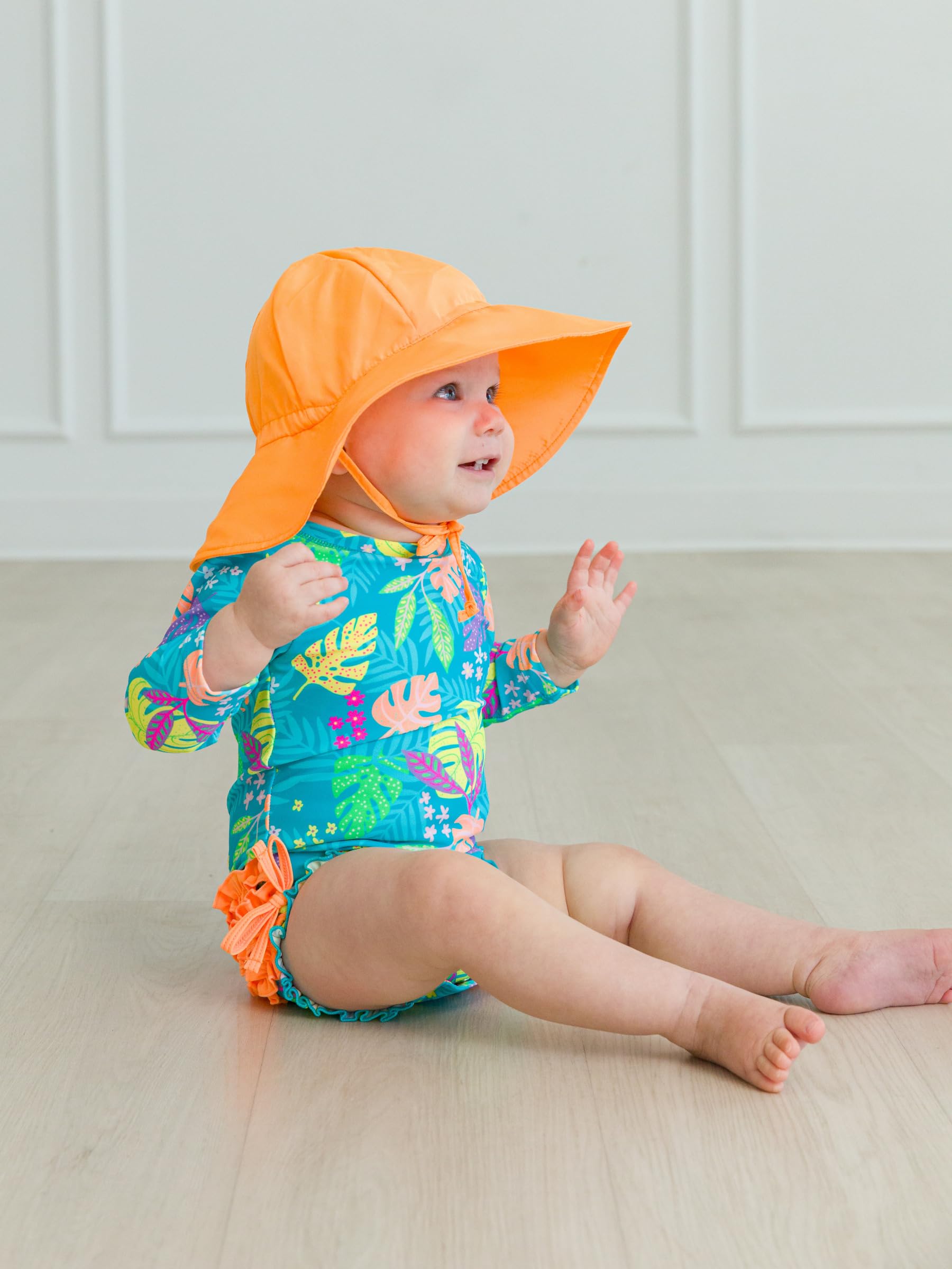 RuffleButts Costume da bagno intero a maniche lunghe con protezione solare UPF 50, a pois, con cerniera, a pois color acqua brillante, 3-6 m