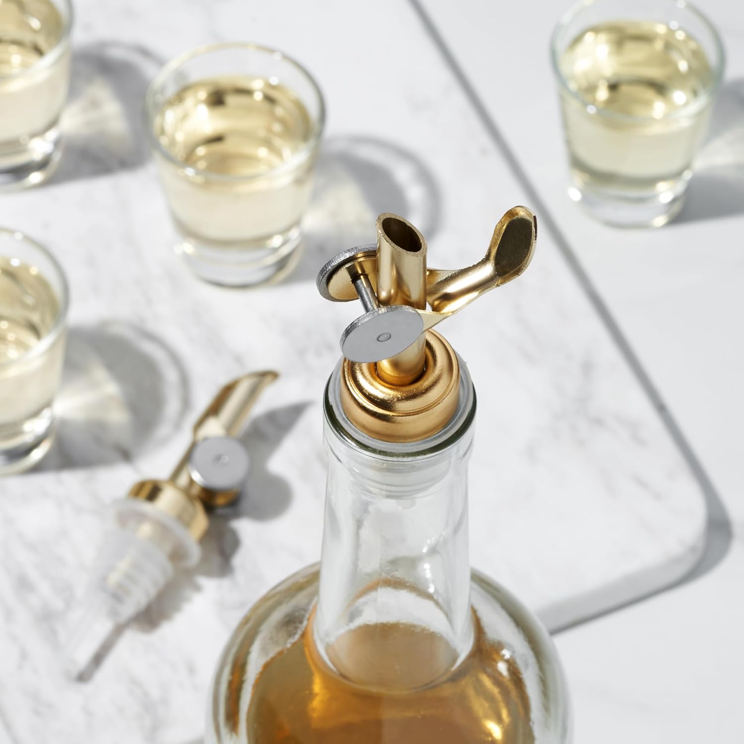 True Glide Weighted Pourers with Self Closing Feature for Liquor, Wine, Oils, or Vinegar, Stainless Steel, Gold, Set of 2