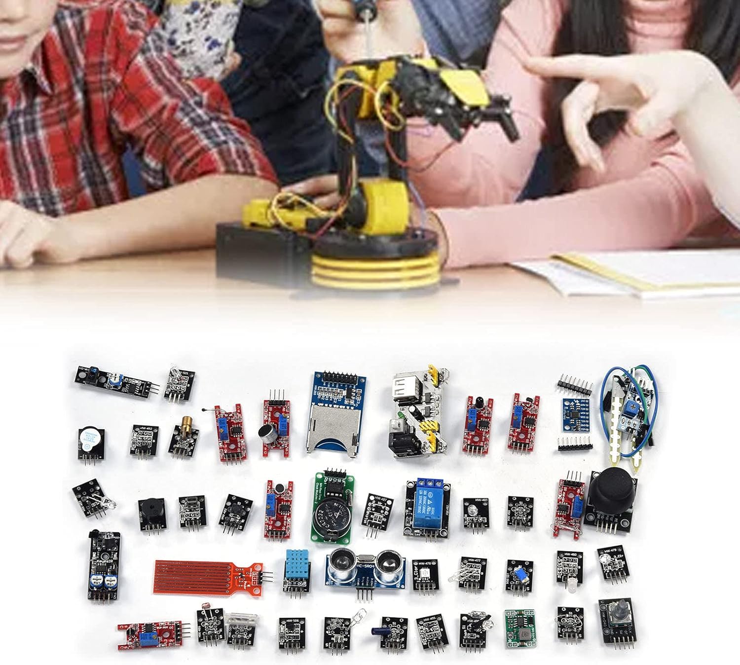 Children working on an electronics project with various modules