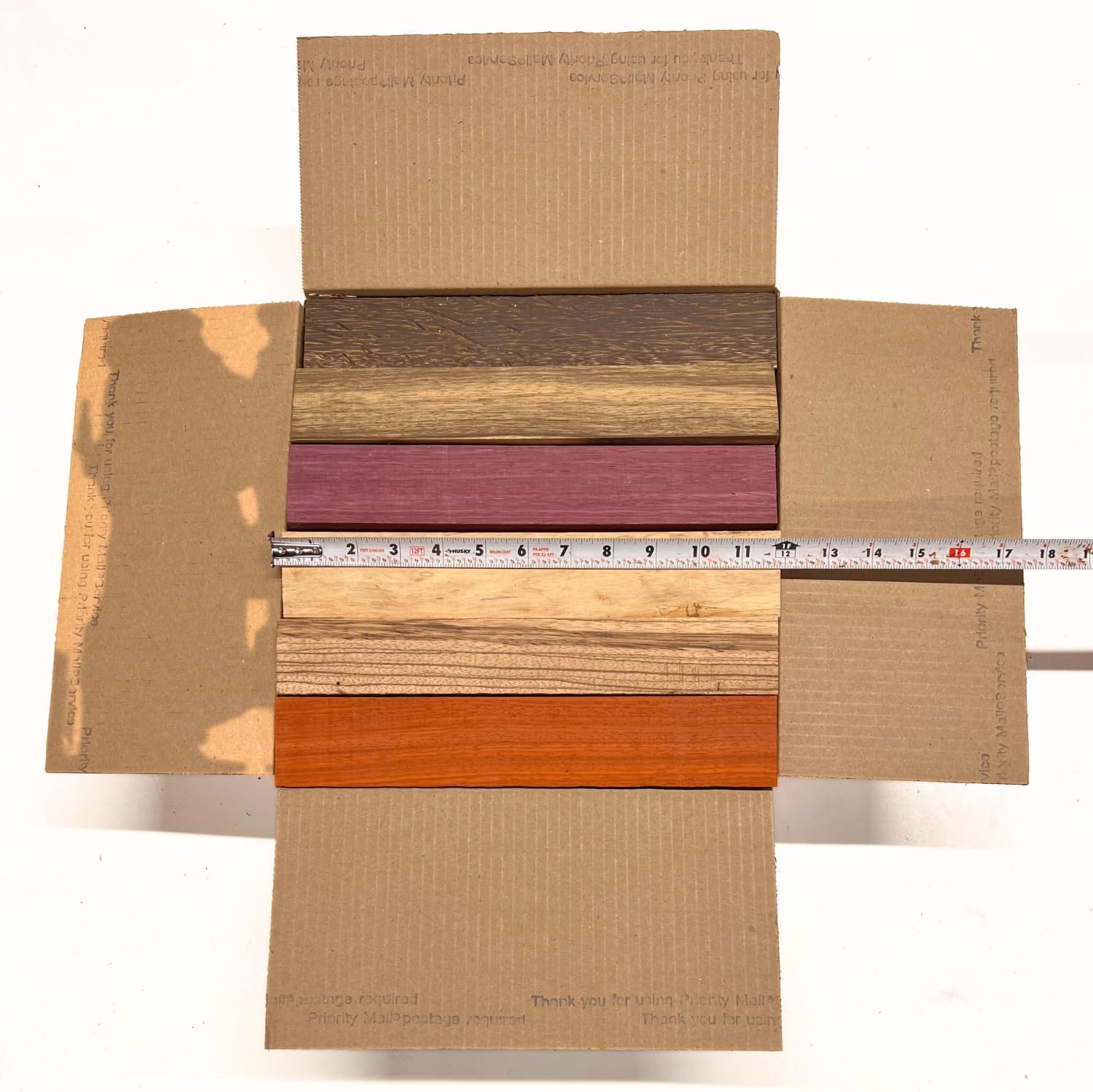 Exotic Wood Zone's Scarp Wood Cut Offs Box of Mixed Exotics (Purpleheart, Padauk, Black Palm, Bubinga, Tamarind and Black Limba) Wooden Scrap Craft Carving Scrolls Short Lumber Boards |