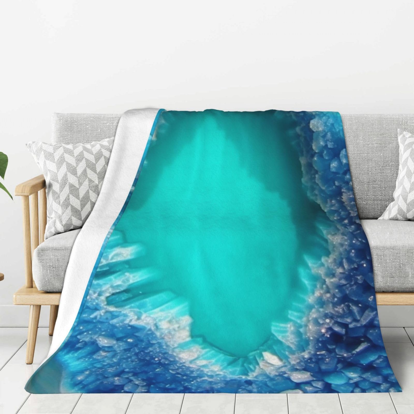 Couverture polaire légère bleu turquoise : fini le froid sur votre canapé