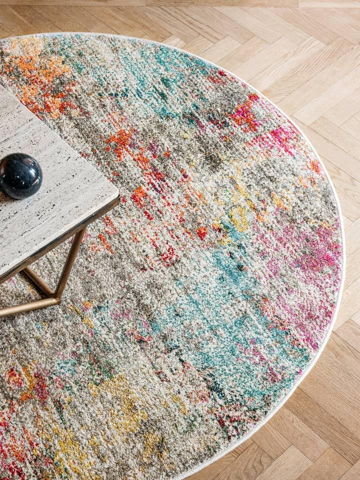 Tapis rond multicolore Ø 200 cm à poil moyen parfait pour sublimer le design du salon
