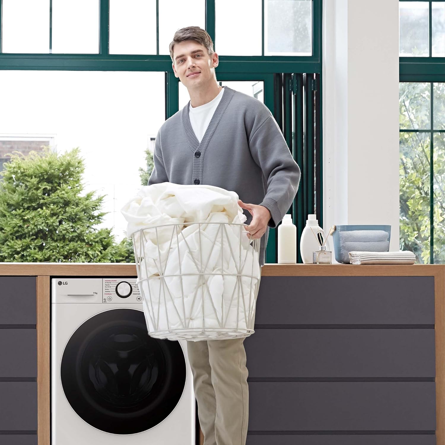 Person Loading Laundry into Washing Machine