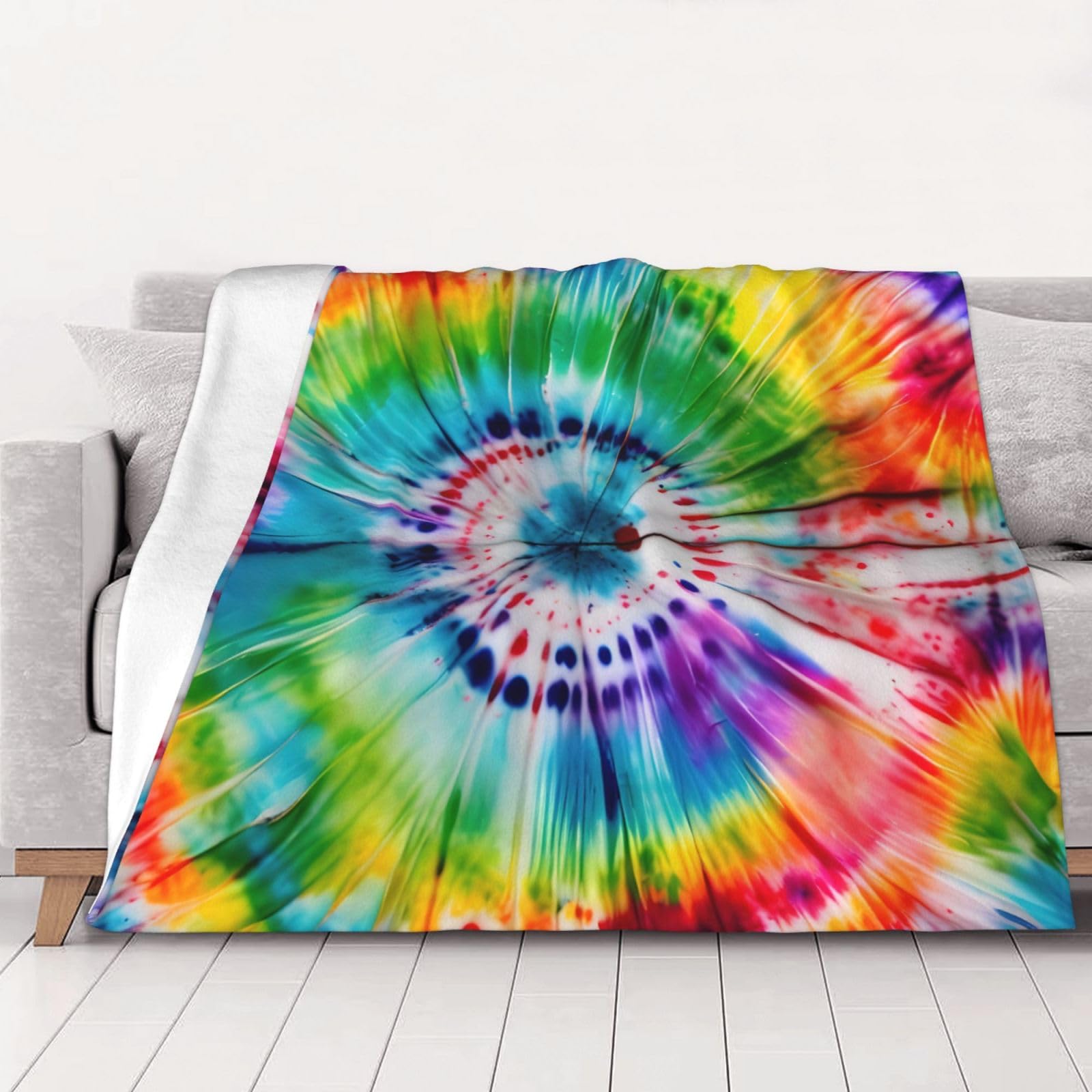 Couverture en flanelle tie dye pour un salon cocooning et lit douillet