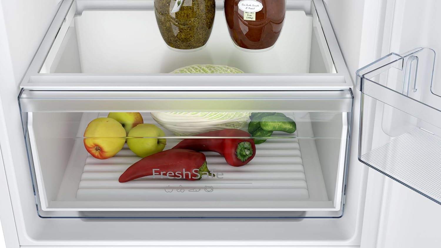 Close-up of the Fresh Safe drawer inside the refrigerator, filled with fresh fruits and vegetables.
