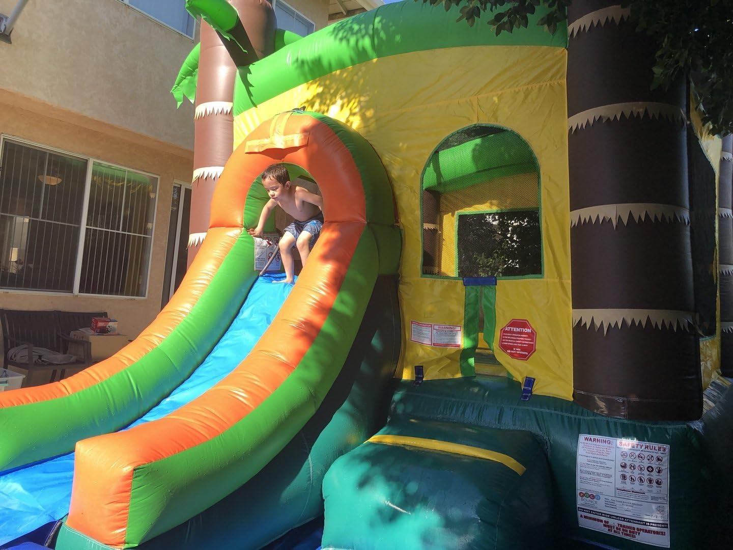 Bounce House with Inflatable Water Slide for Kids, Backyard Commerical Tropical Castle Outdoor Playhouse Bouncer with Splash Pool, Includes Blower, Anchor Stakes and Storage Bag, 26.5 x 12 x 14.5