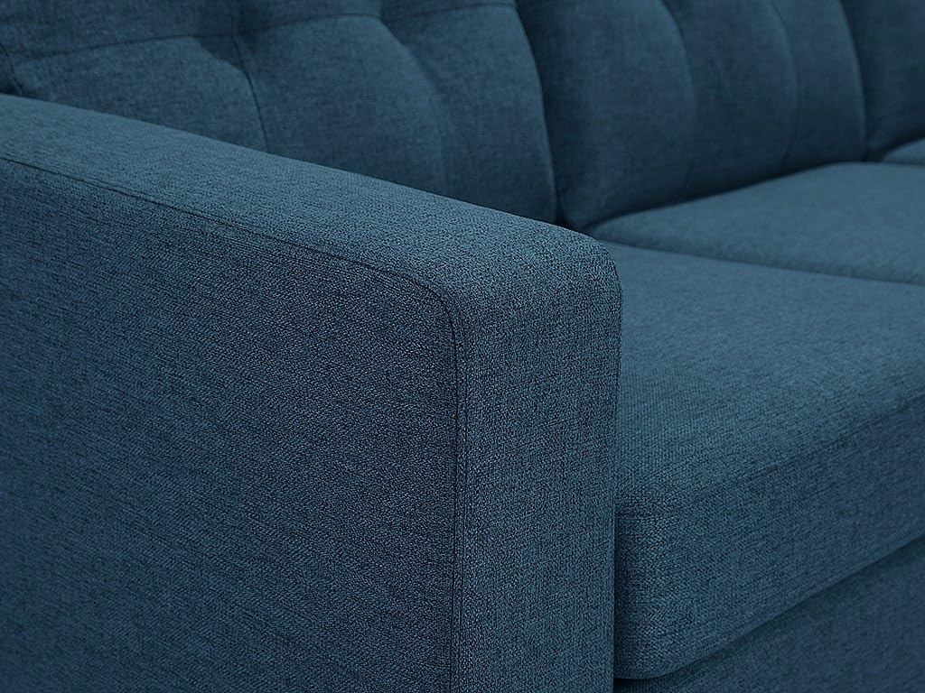 Detail of the sofa's back cushions with tufting