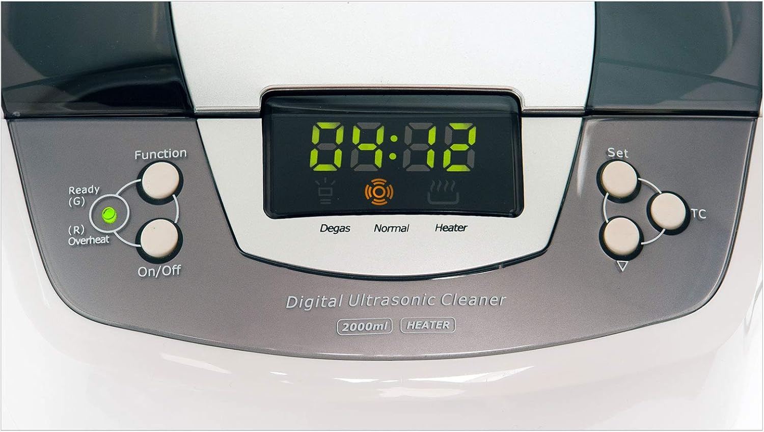 ക്ലോസ് അപ്പ് view of the digital control panel of the DEMA Ultrasonic Cleaner, showing buttons for Function, On/Off, Set, TC, and a digital display with indicators for Degas, Normal, and Heater.