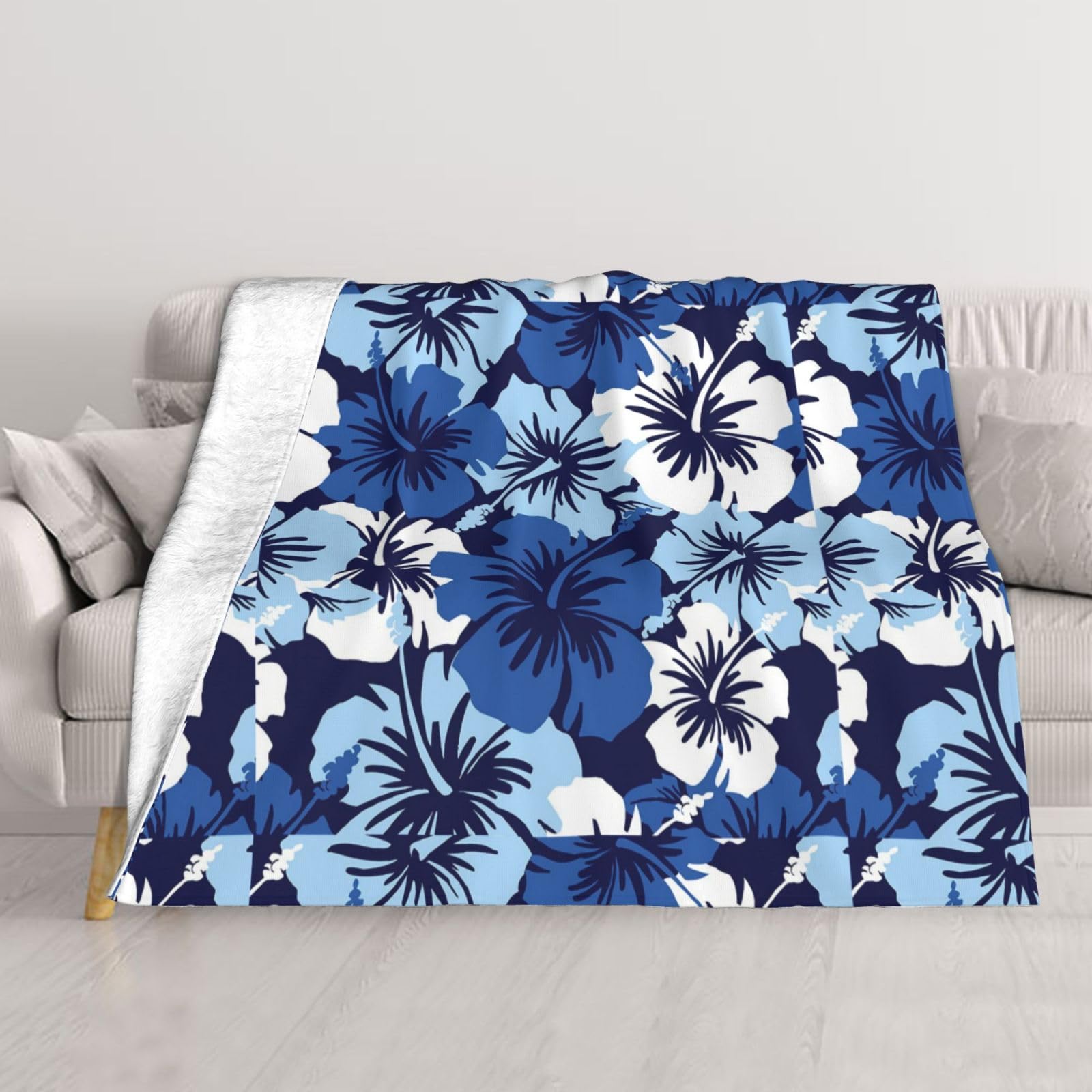 Couverture lit hibiscus bleu pour vos soirées cocooning sur le canapé