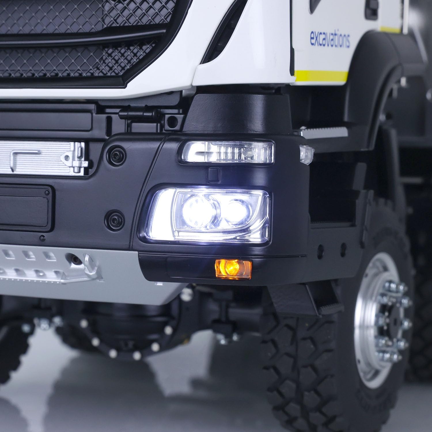 Close-up of the front headlights on the LESU RC Dumper Truck