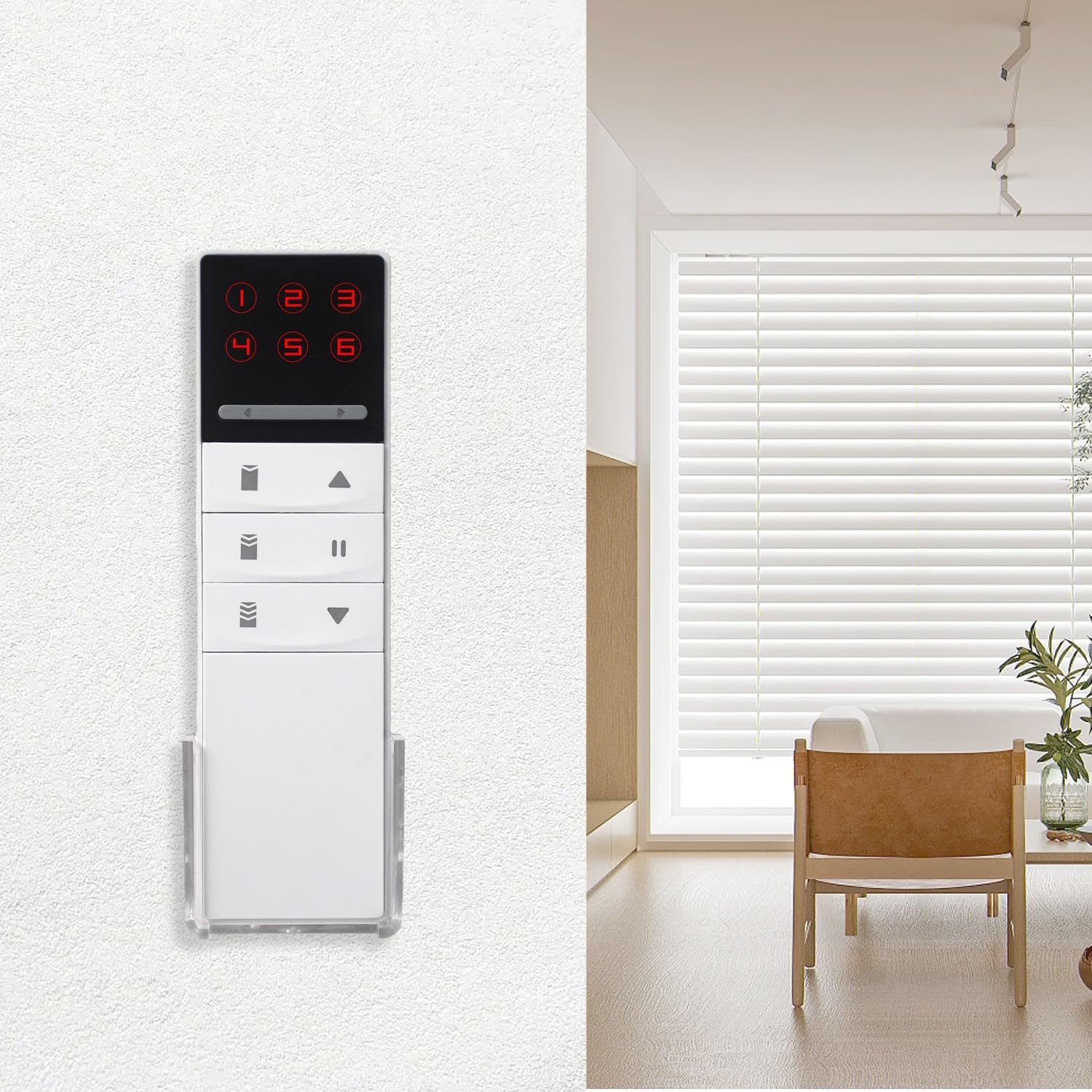 The remote control mounted on a wall using its back holder, next to a window with blinds.