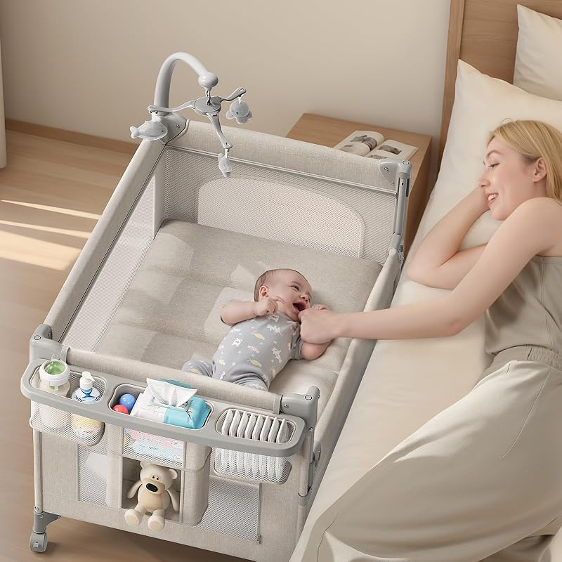 TinyGlow Baby Bassinet, Pack and Play, Bedside Crib Sleeper, Diaper Changer | Quickly Assembles and Folds, Portable Crib with Mattress,Mosquito Net and Toys Bar, Easy to Carry for Newborn to Toddler