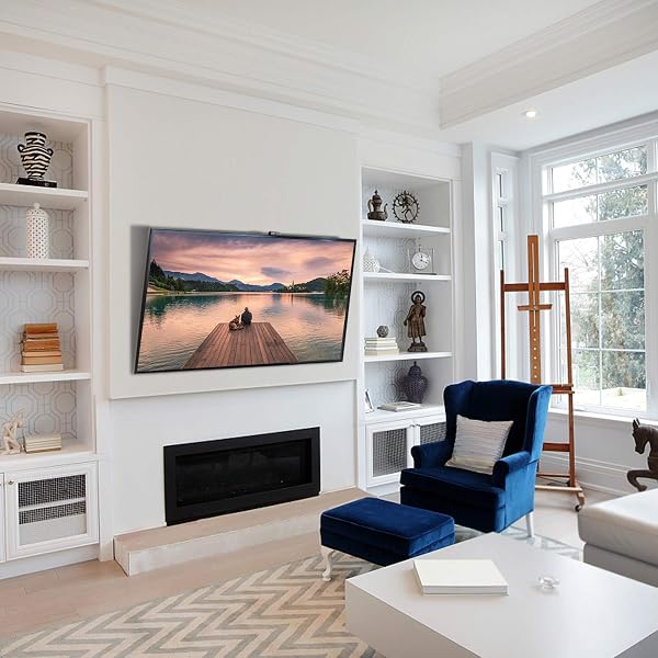 Close-up of the PERLESMITH TV wall mount's low-profile design, showing its slim 1.2-inch profile against a wall.