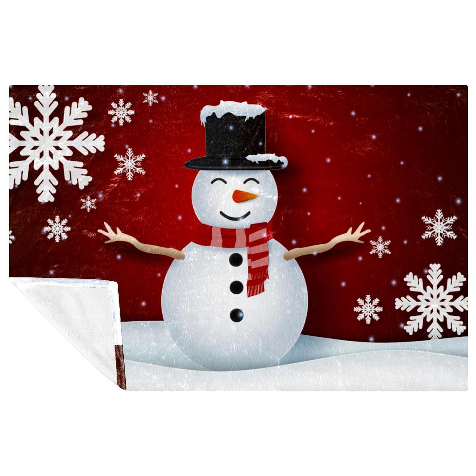 Couverture chaude bonhomme de neige contre le froid sur le canapé