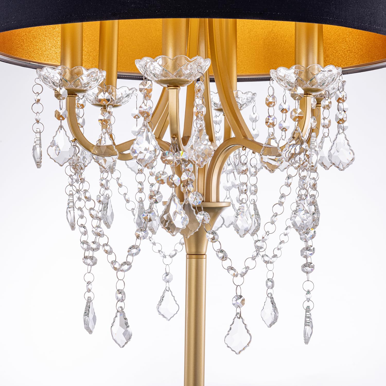 Close-up of the lamp's gold-finished structure with crystal droplets