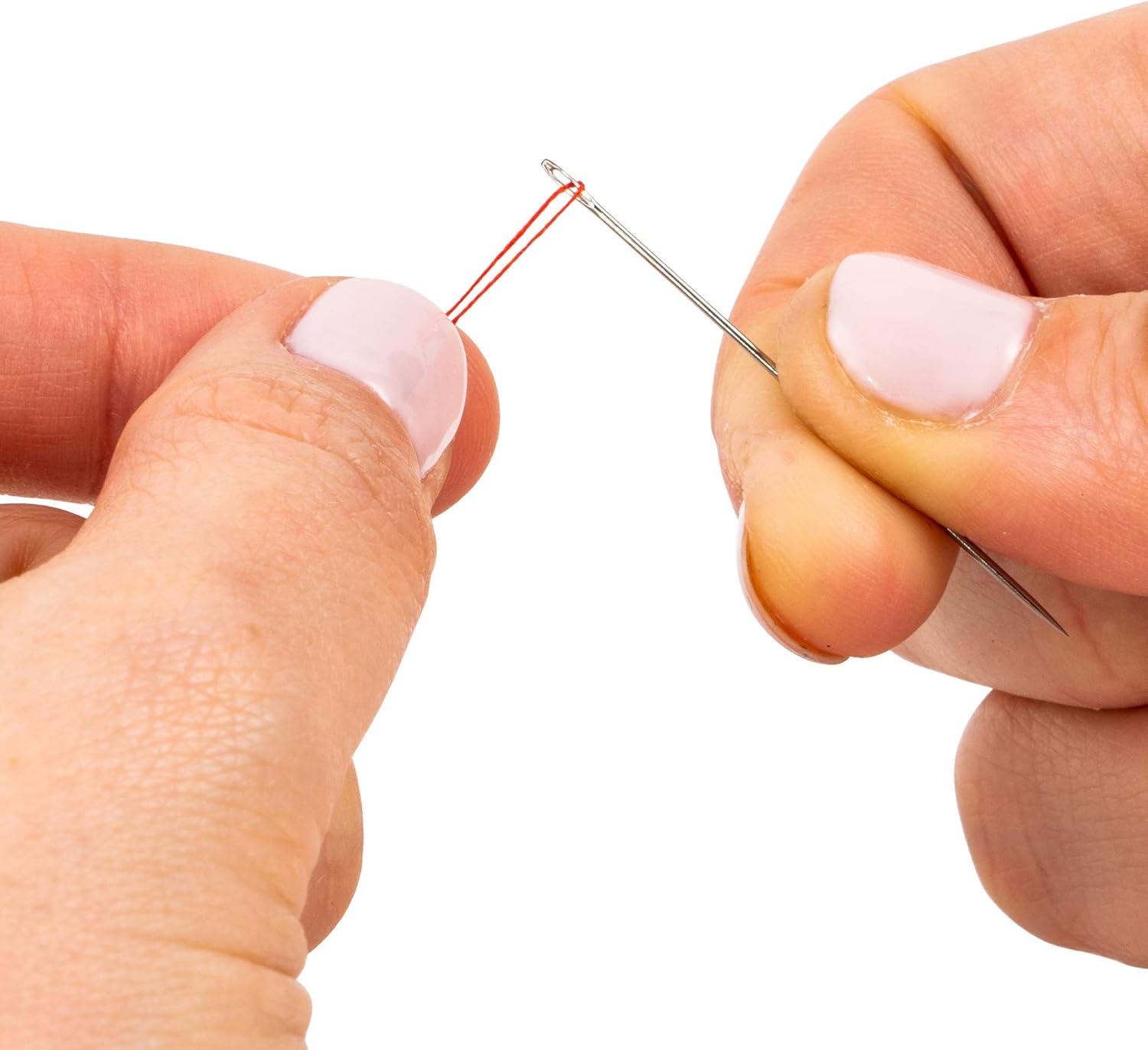 Hands holding a needle with red thread