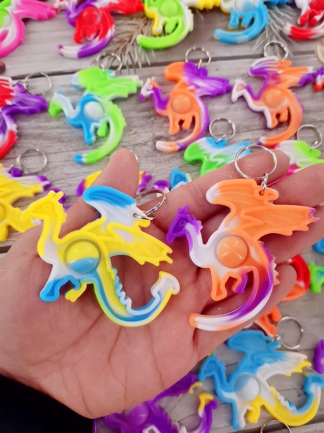 100 Packs Dragon Bulk Mini pop Fidget Gifts for Holiday Boys and Girls Kids Party Favors Supplies and Classroom Students Prize