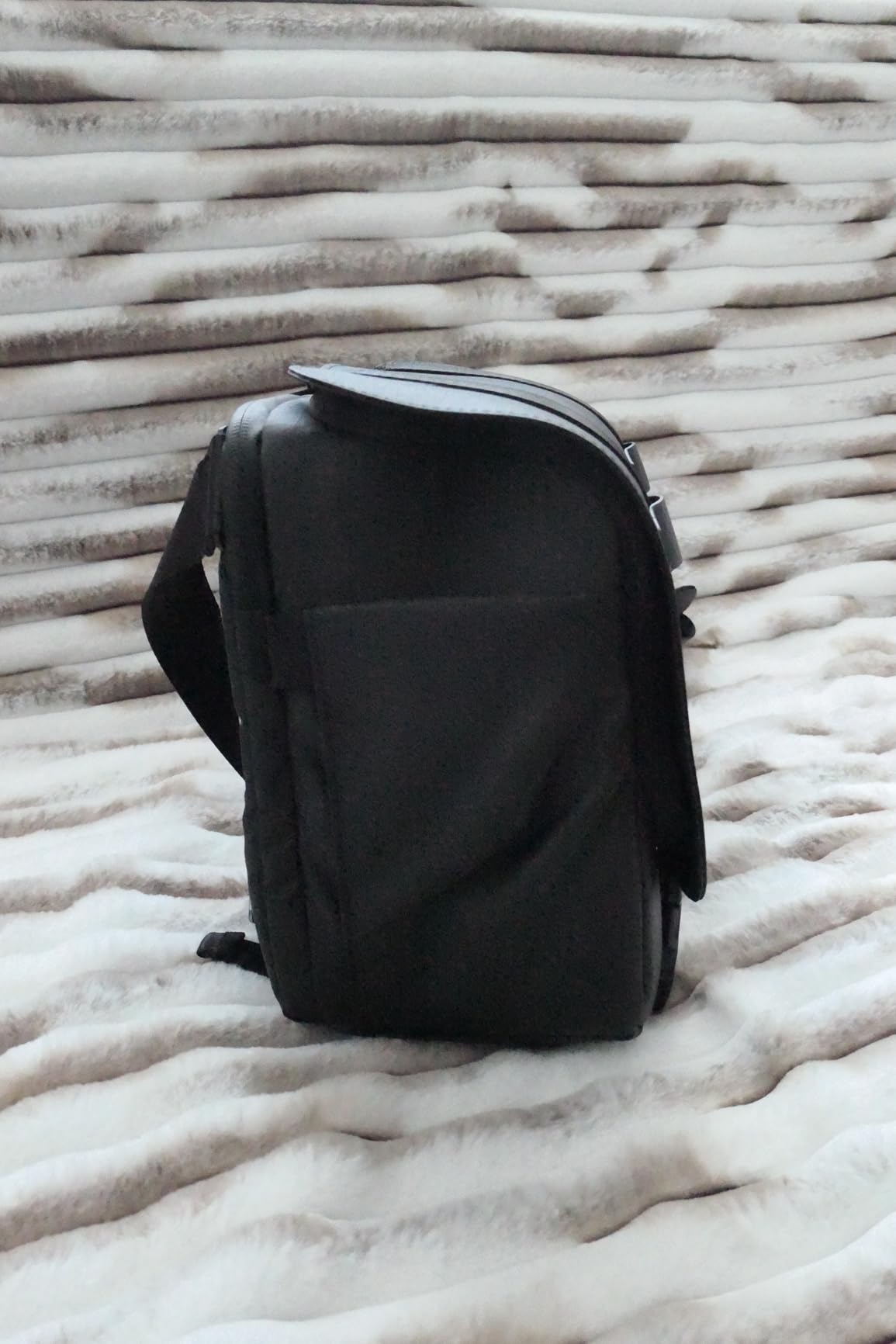 Decent mid-sized photographer's sling bag, good size to capacity ratio, quality materials