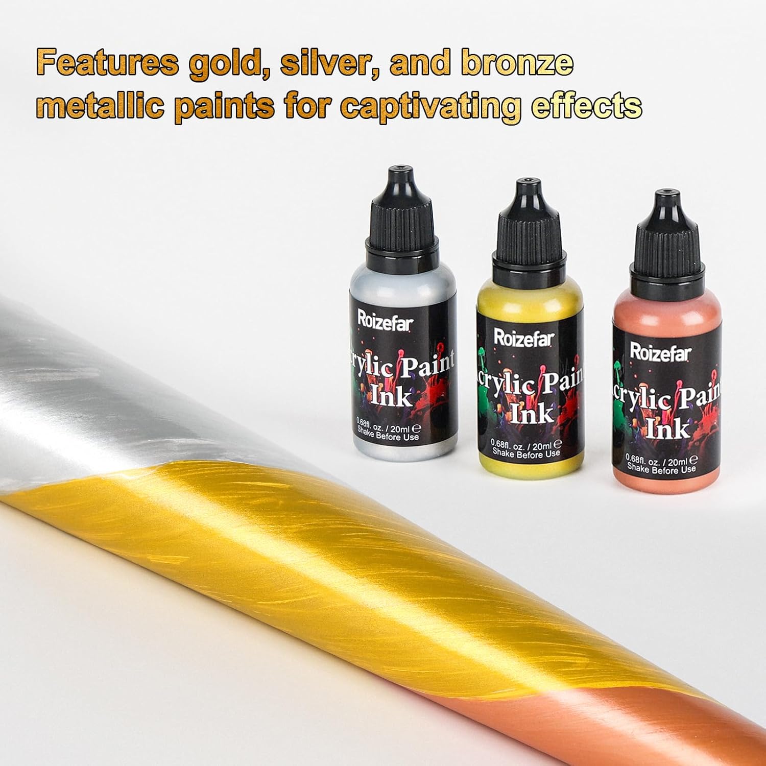 Metallic gold, silver, and copper acrylic inks applied to a surface, showing their reflective quality
