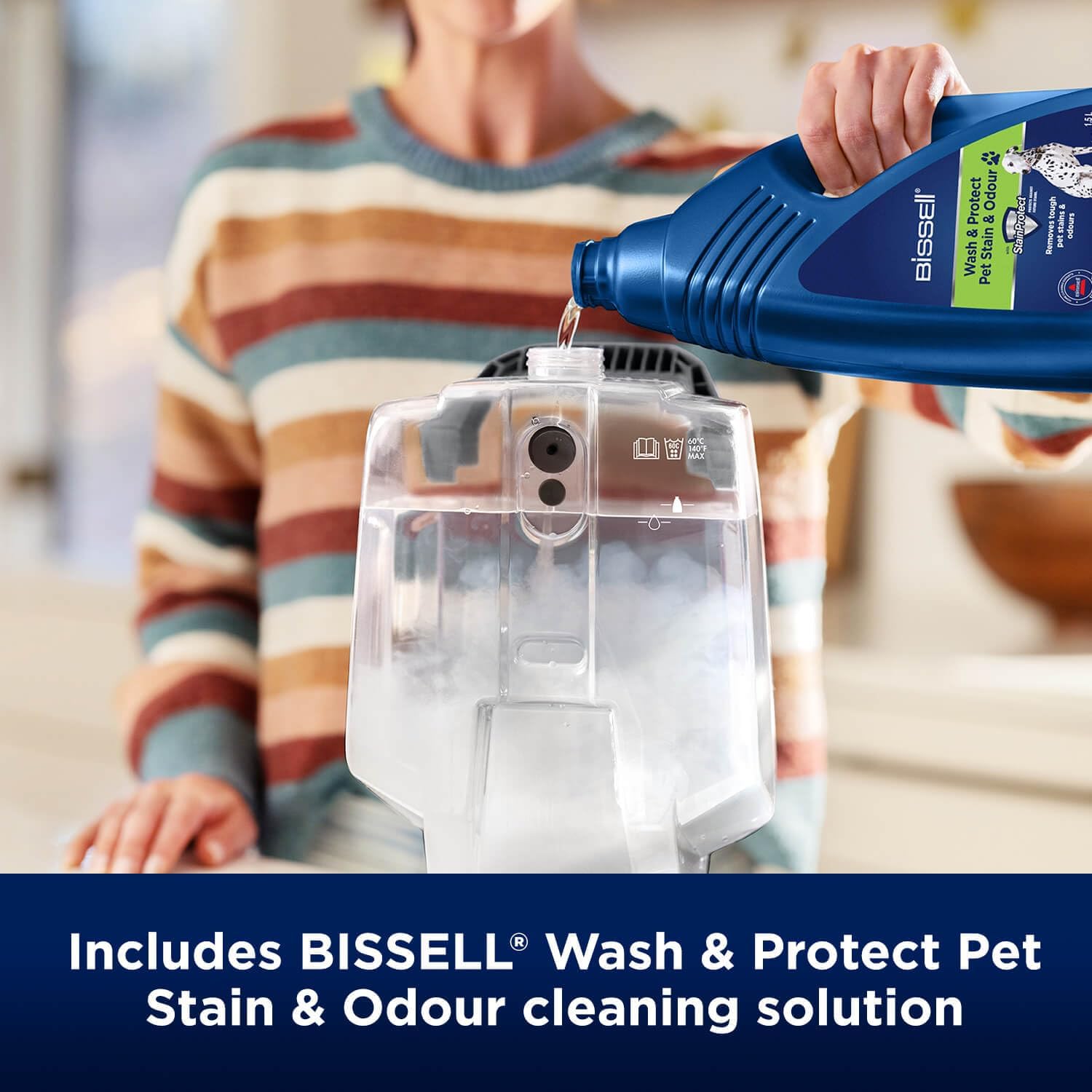 Person pouring BISSELL cleaning solution into the clean water tank