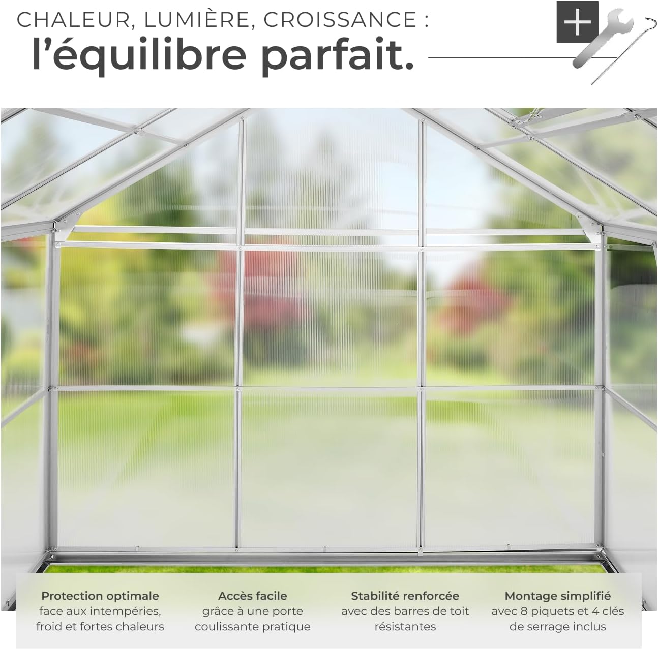 Interior view of the tectake greenhouse, showing ample space for plants and the transparent polycarbonate panels.