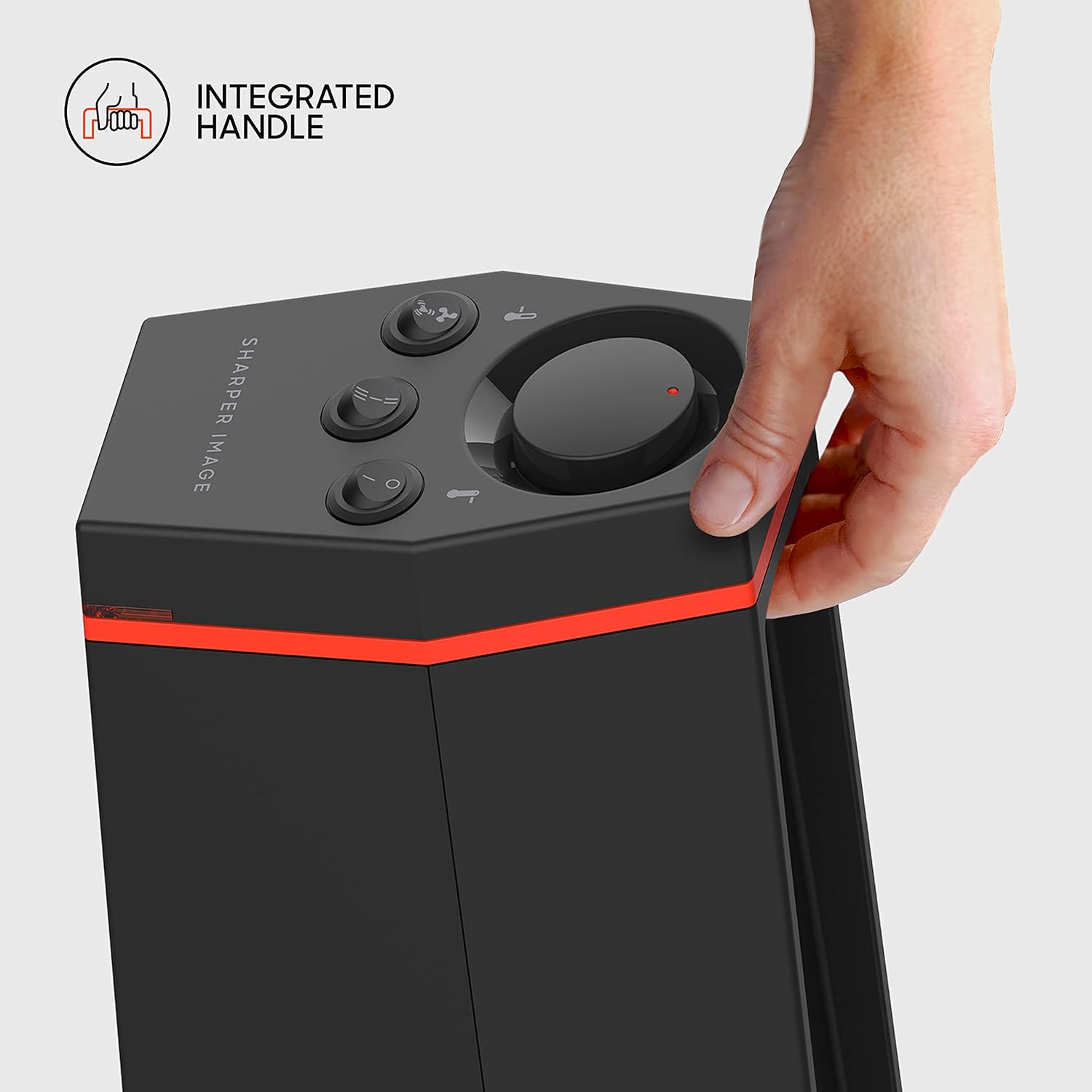 A hand using the integrated handle on the top of the Sharper Image RISE 20H Tower Space Heater for easy carrying.