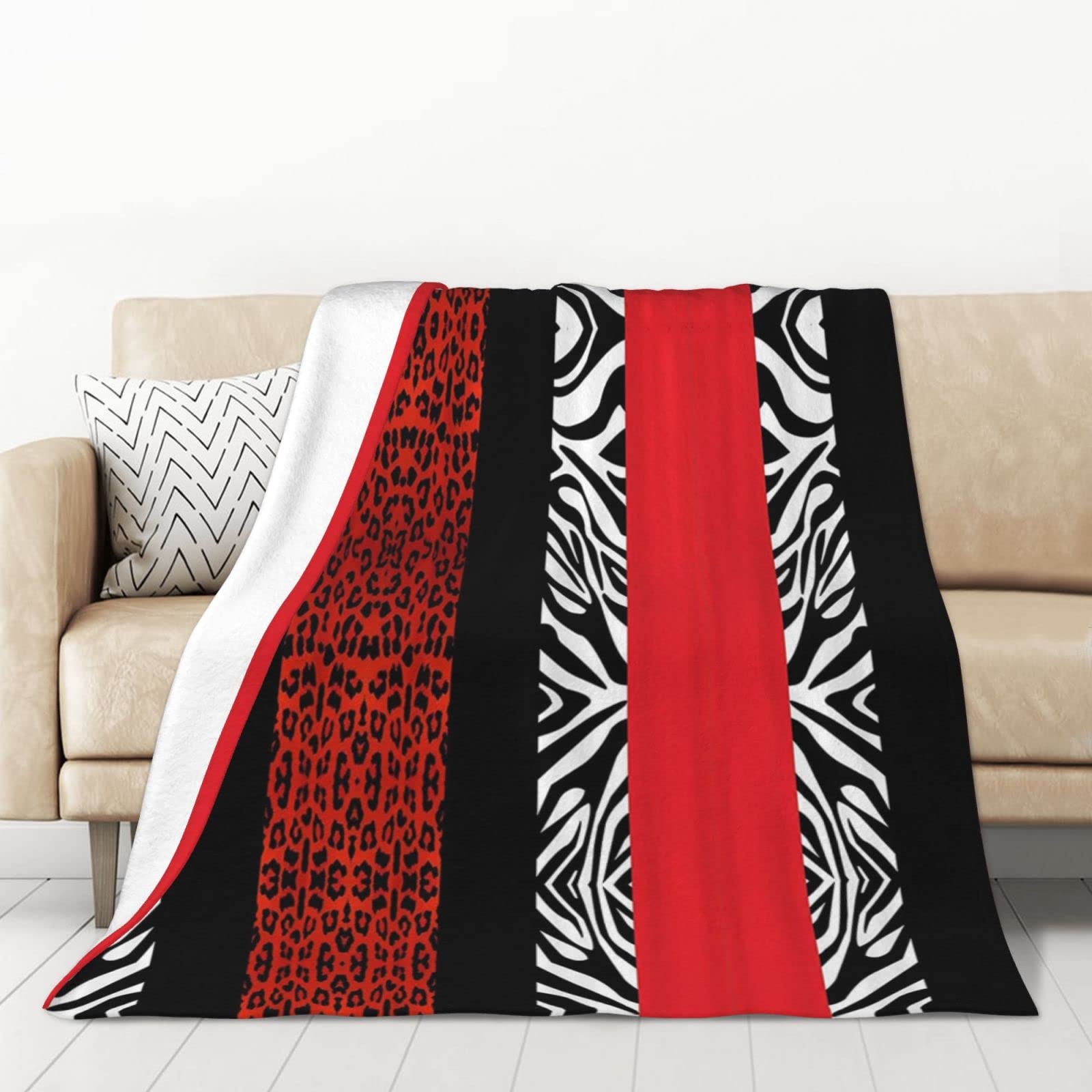 Couverture léopard rouge en flanelle pour un canapé chaleureux
