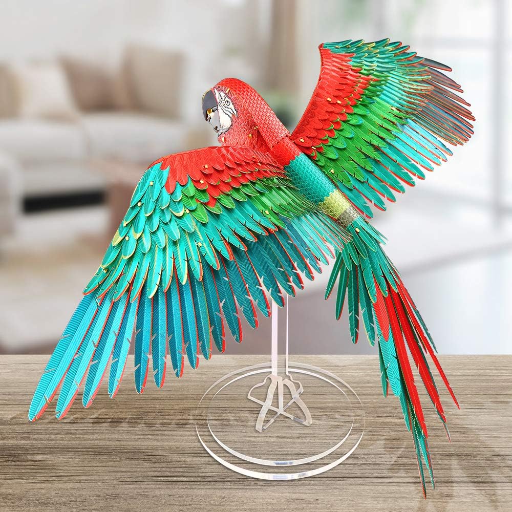 Finished Macaws model displayed on a wooden surface with a clear stand.