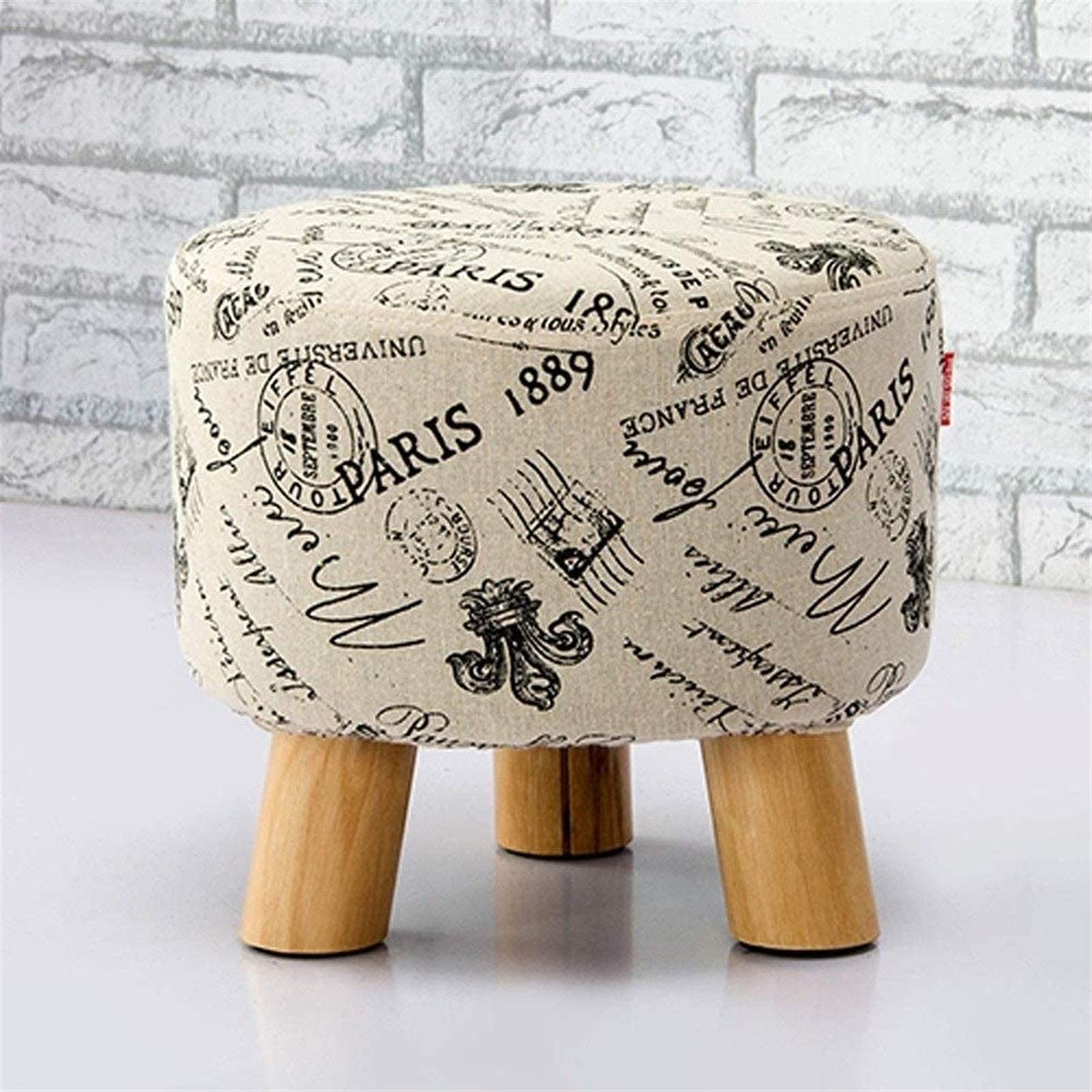 Pouf rond en bois comme repose-pieds stable de salon