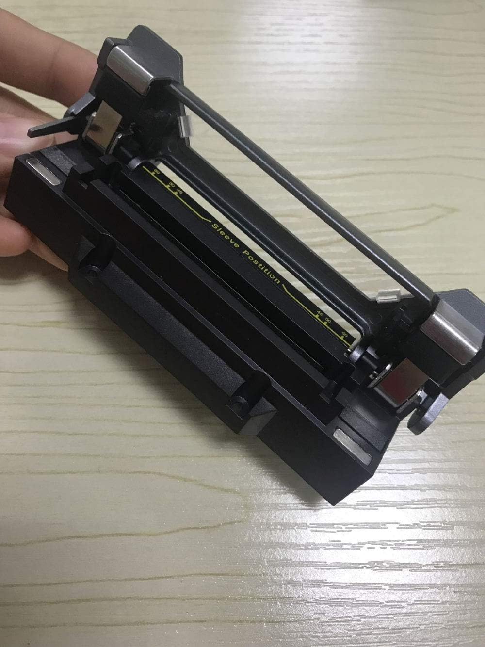 לִפְתוֹחַ view of the KOMSHINE FX37 Fiber Optic Heater, revealing the heating chamber and sleeve guide.