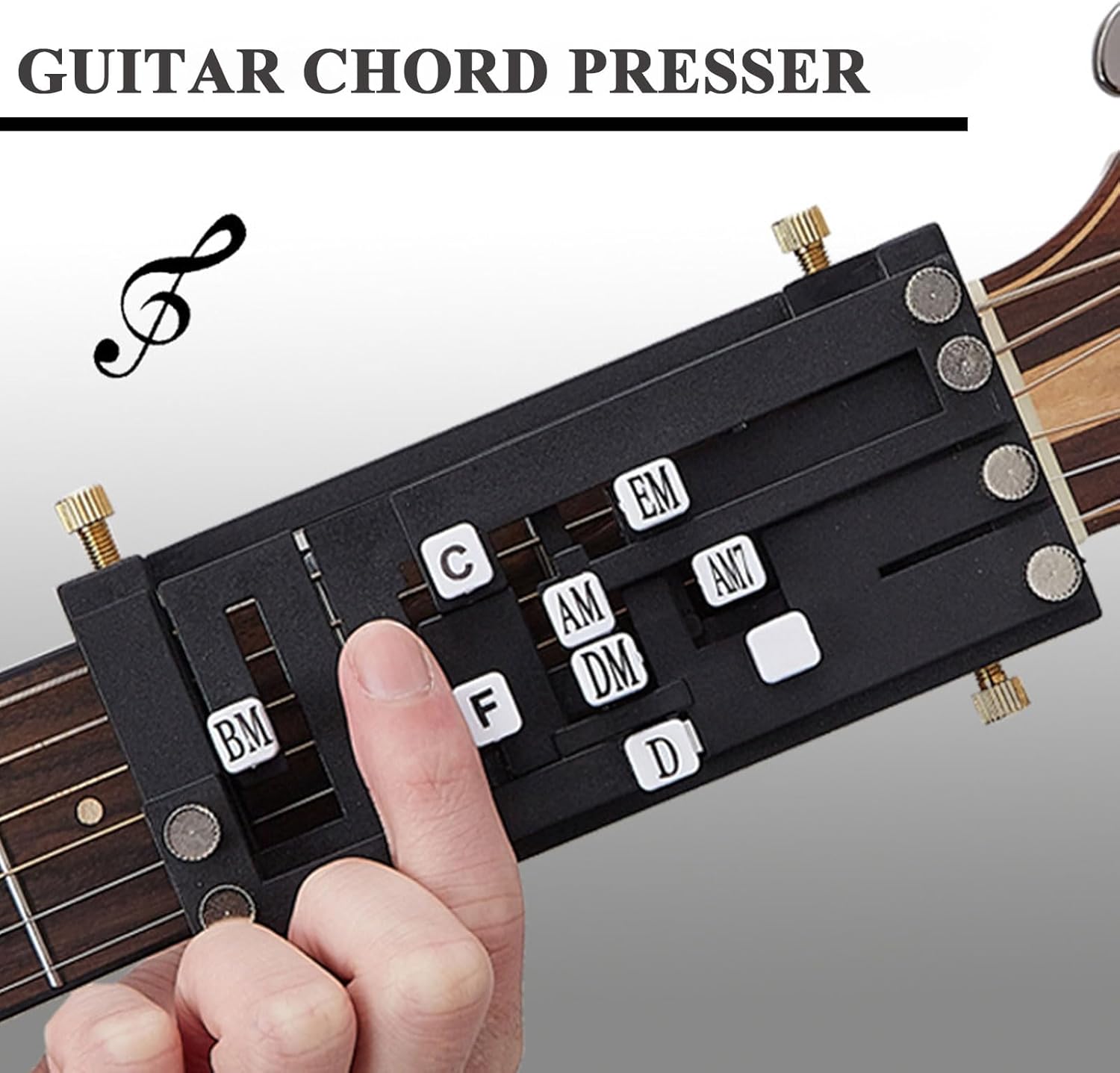 Close-up of a finger pressing the 'C' chord button on the Guitar Chord Presser.
