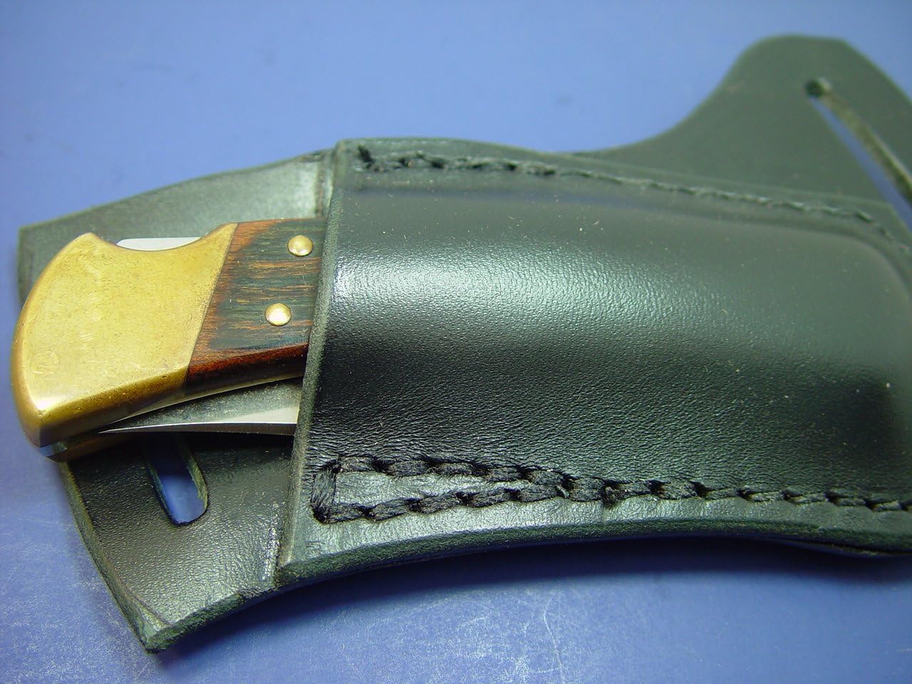 Black Buck 110 Right Hand Cross Draw Knife Sheath. The Sheath Is Made Out of 8 Oz. Leather Made to Wear on the Left Side and Drown on the Right Hand.