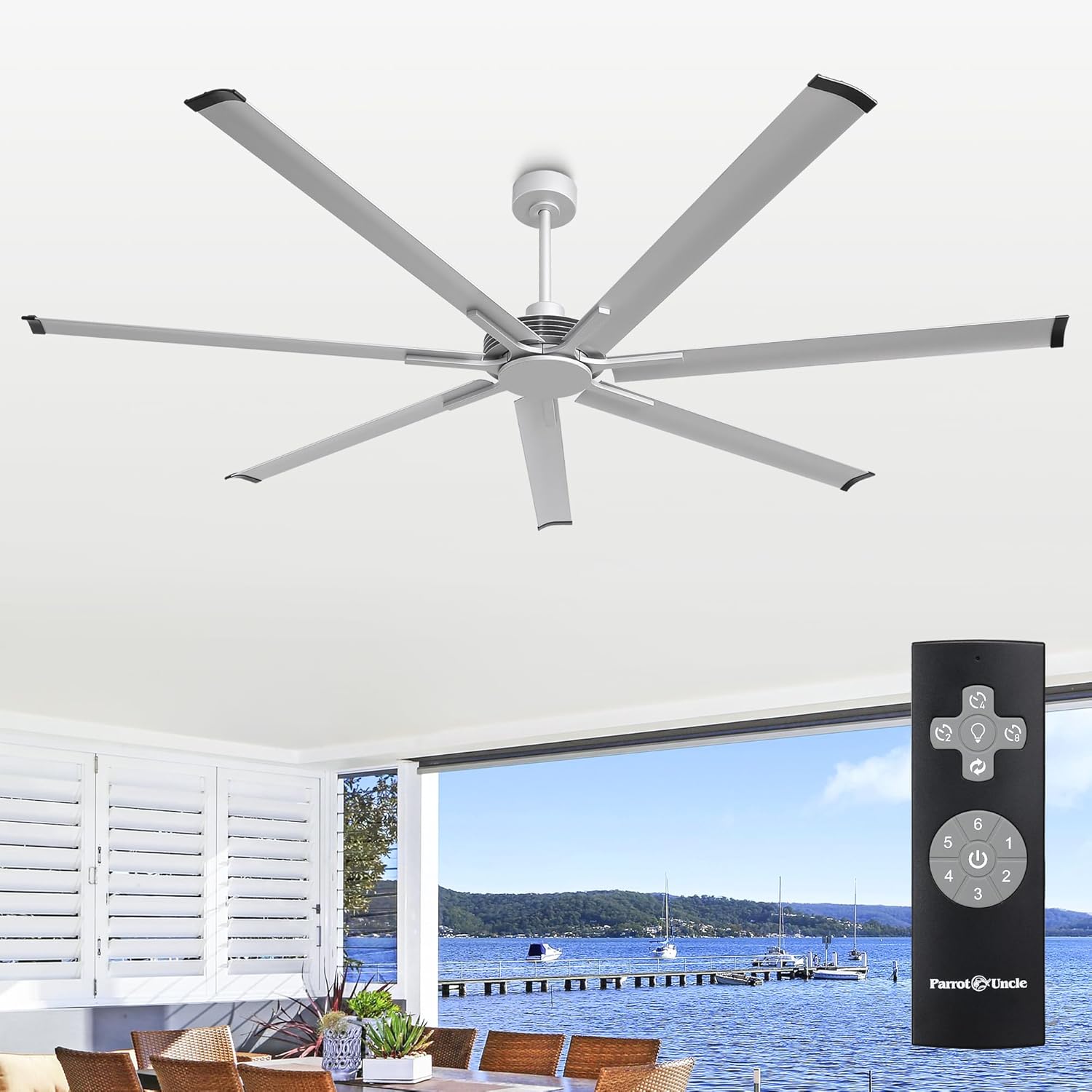 Parrot Uncle 84-inch industrial ceiling fan installed in a modern living space with a view of the ocean.