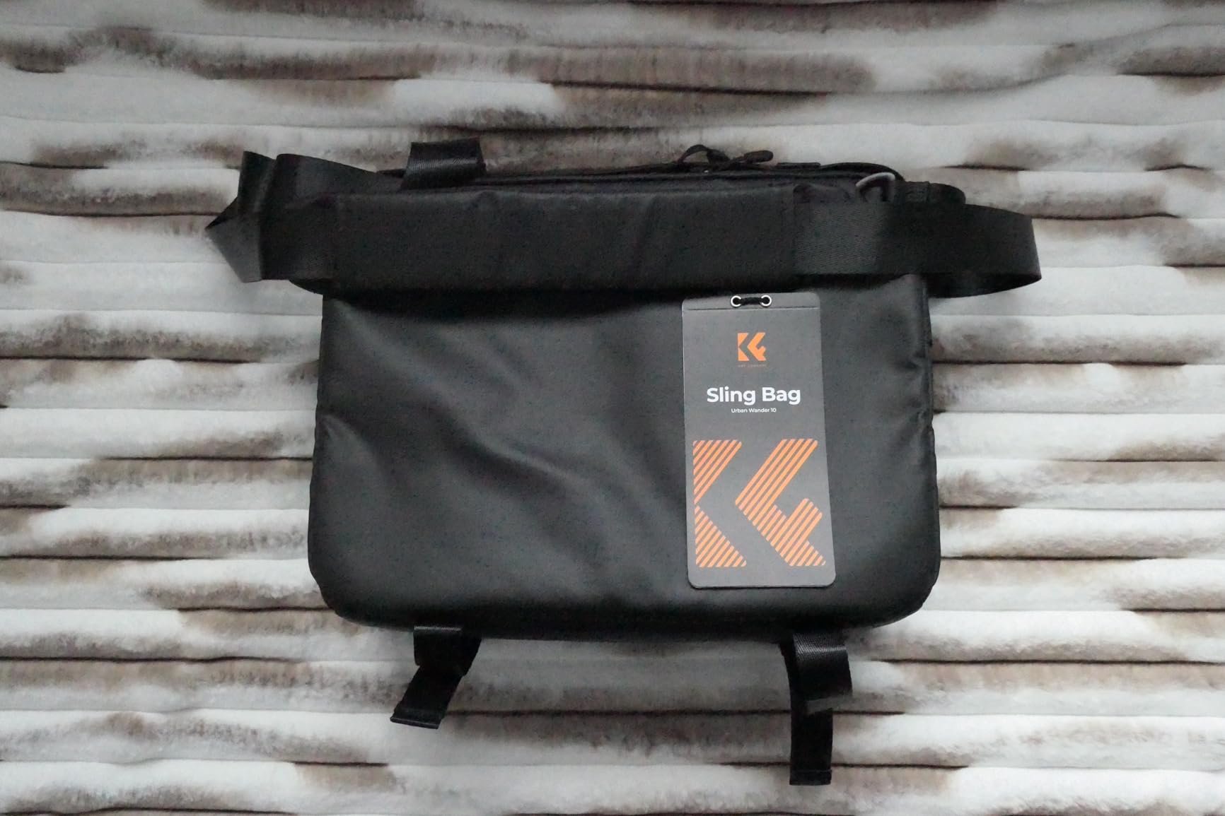 Decent mid-sized photographer's sling bag, good size to capacity ratio, quality materials