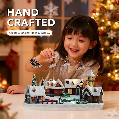 Miniatura 2 de Aldea de Navidad, decoraciones de Navidad animadas con trineo de Santa volando sobre la ciudad, centro de mesa musical de Navidad con luces LED