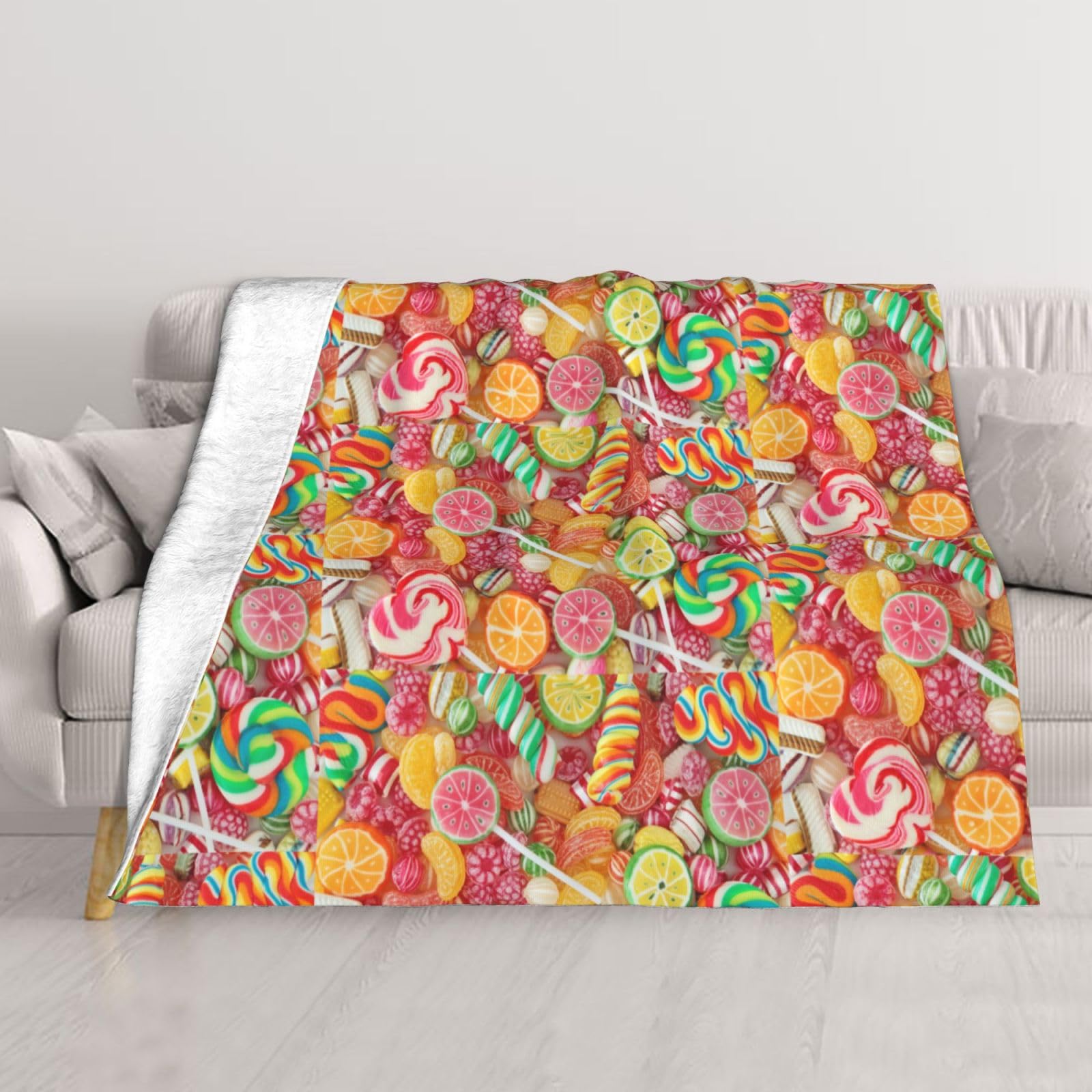 Couverture de bonbons chaude pour lit et soirées cocooning sur le canapé