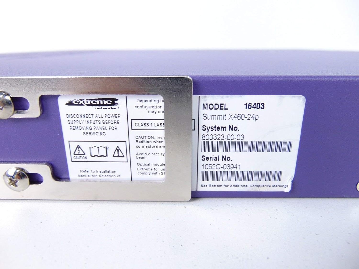 Close-up of the product label on the Extreme Networks Summit X460-24p switch, showing Model 16403, Summit X460-24p, System No. 800323-00-03, and Serial No. 1052G-03941.