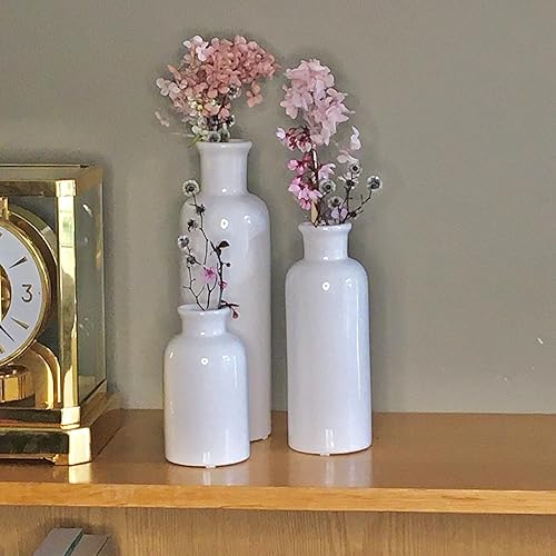 Miniatura 9 de Juego de 3 hermosos jarrones de cerámica. Acabado blanco paloma texturizado. Una adición atractiva y sofisticada para cualquier decoración.