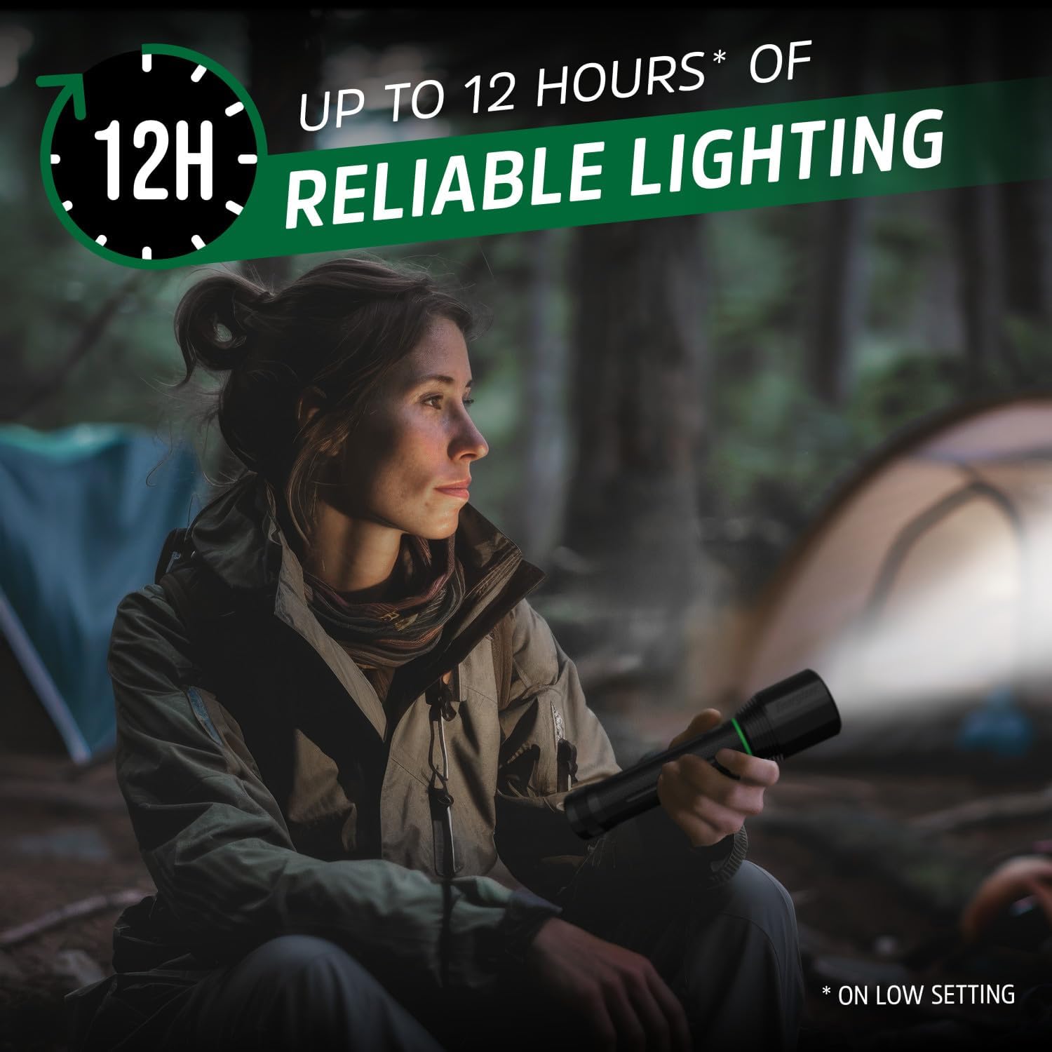 Woman using Energizer 3500XT-R flashlight near a tent, highlighting 12 hours runtime