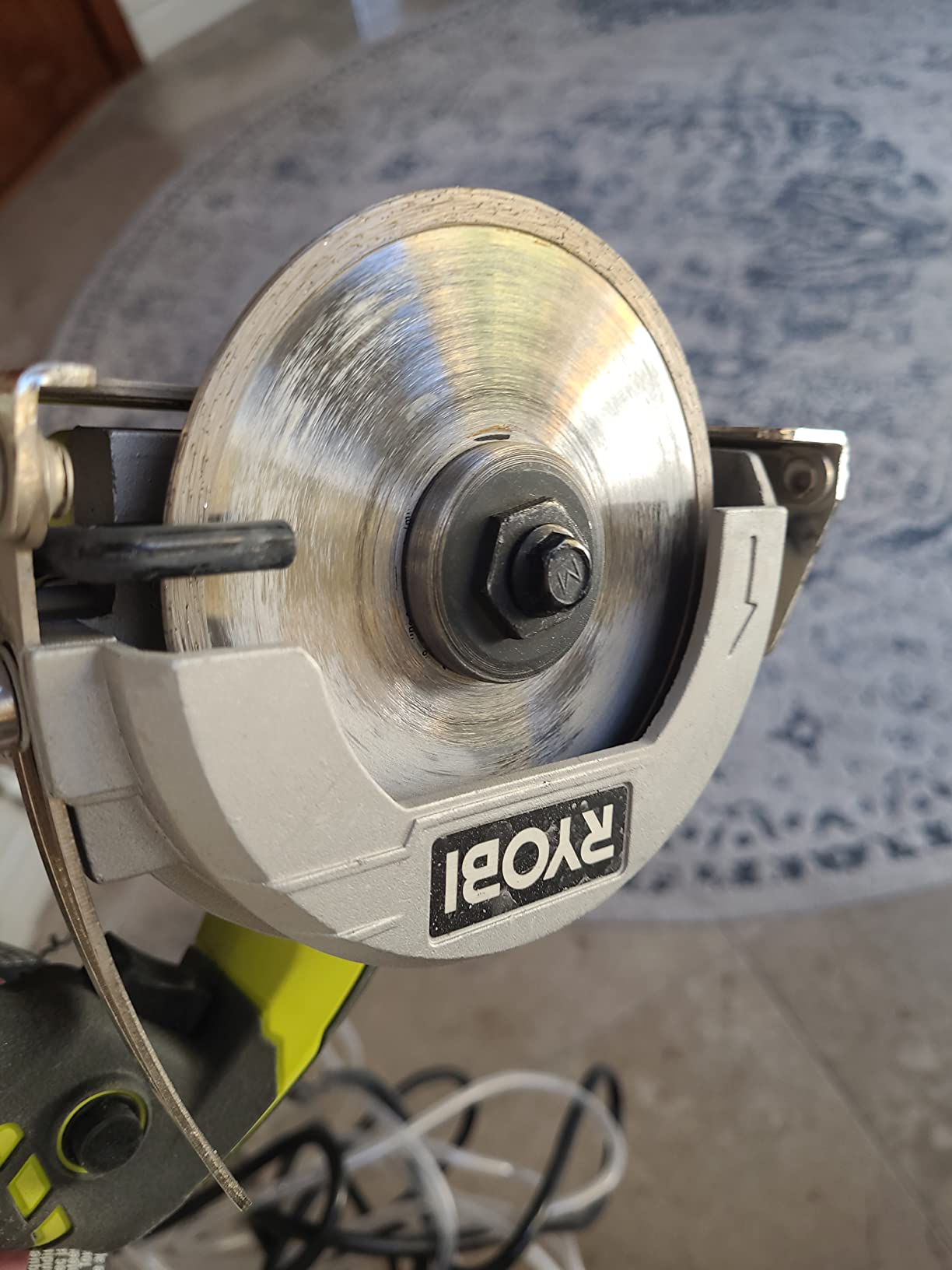 Ryobi tile saw sitting on a folding stand ready to cut ceramic tile
