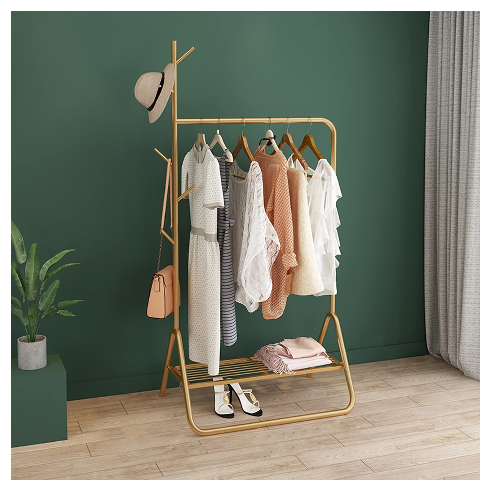 Porte-vêtements robuste en métal doré avec étagère basse de rangement