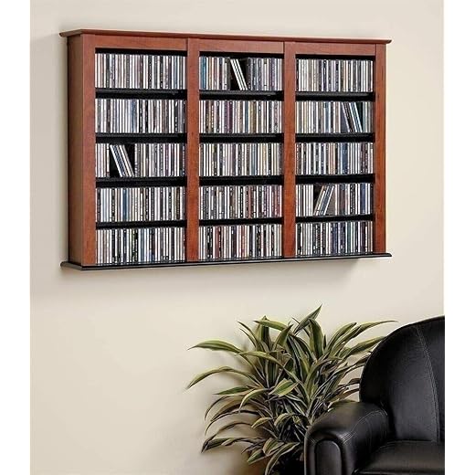 Manoch Cherry Finish Wooden Media Storage Cabinet CD DVD Organizer Wall Mount Shelf Material: Laminated Composite Woods Capacity: 523 CDs, 213 DVDs, 408 Blu-Ray Discs, 124 VHS Cassettes