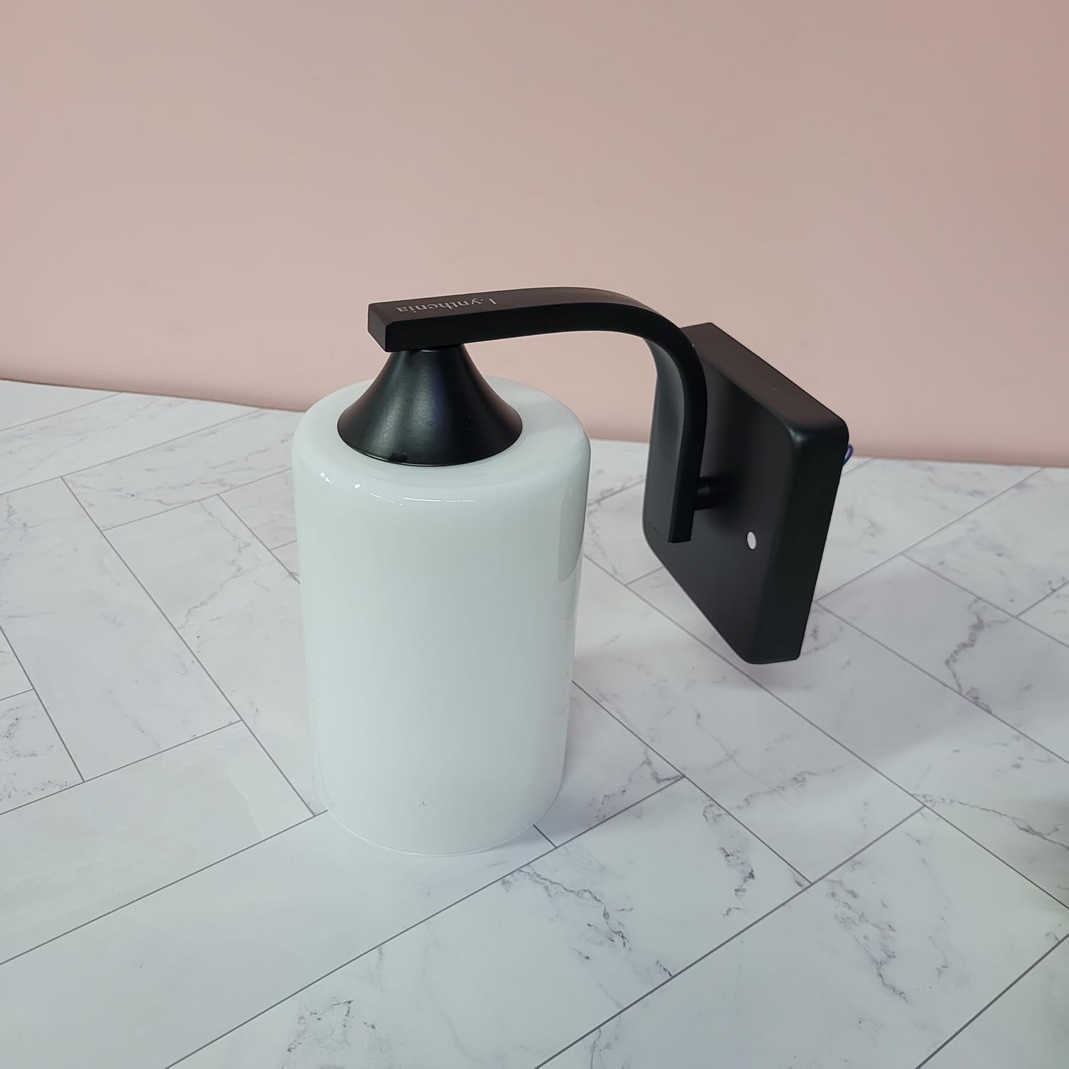 Lynthenia Wall lights This minimalist black and white wall lamp features a milky white glass shade, suitable for bedrooms, hallways, and living rooms.