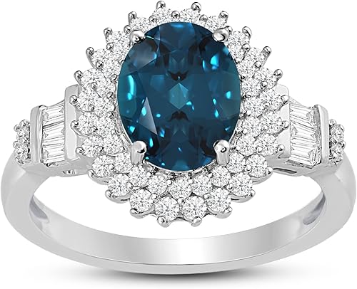 Jewelili Anillo de compromiso de plata de ley de 0.354 x 0.276 in con topacio azul Londres ovalado con baguette y zafiro blanco redondo creado