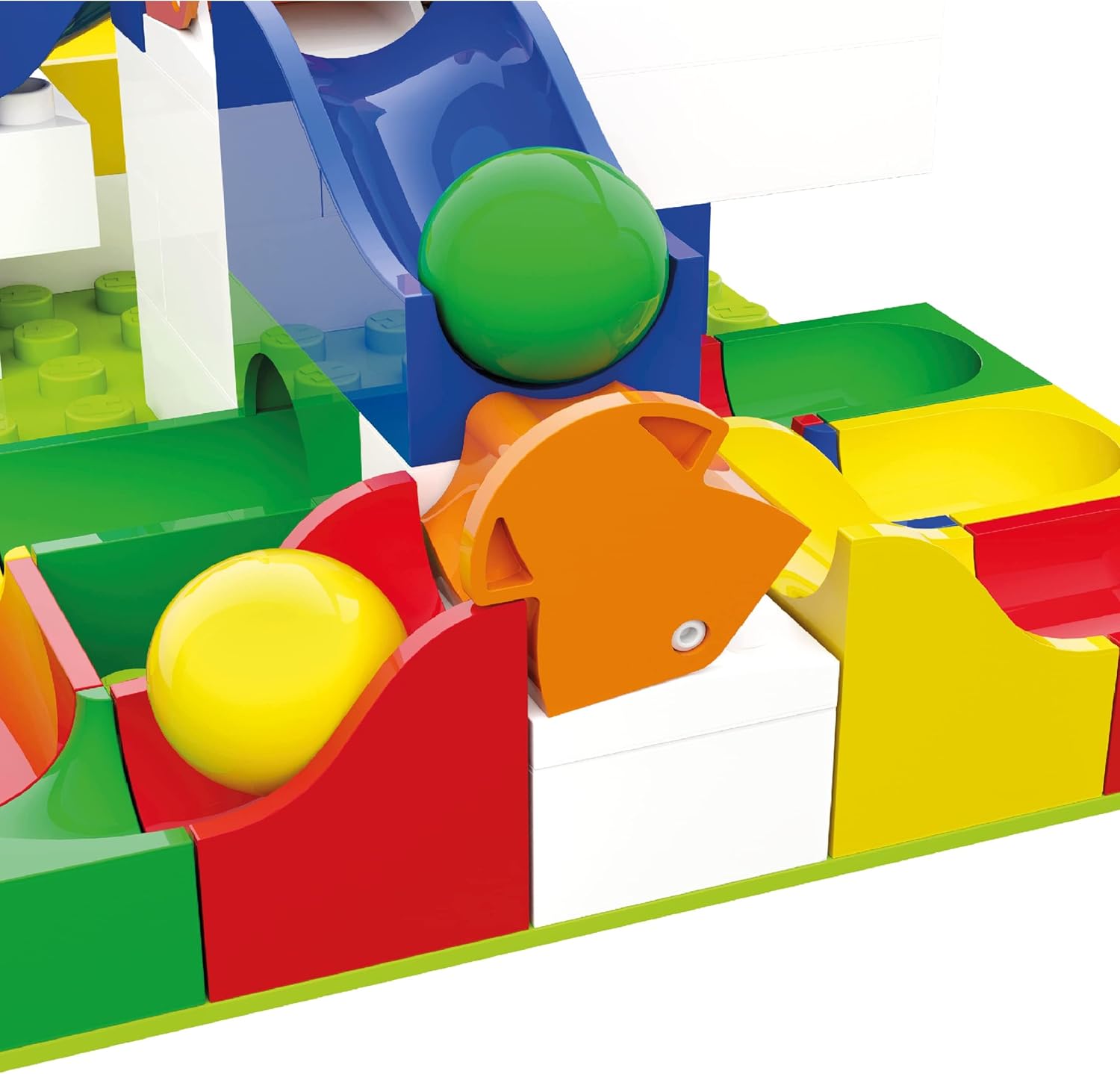 Various Hubelino track elements and marbles, including switch pieces, curves, and straight tracks, laid out for assembly.