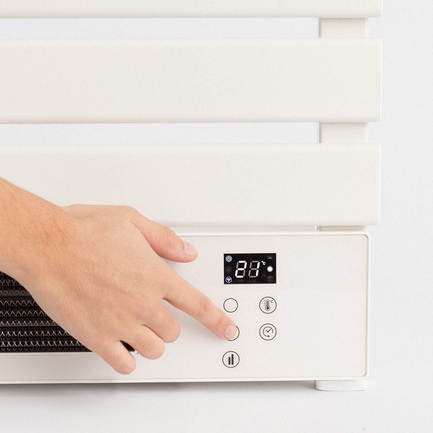 Hand pressing buttons on the control panel