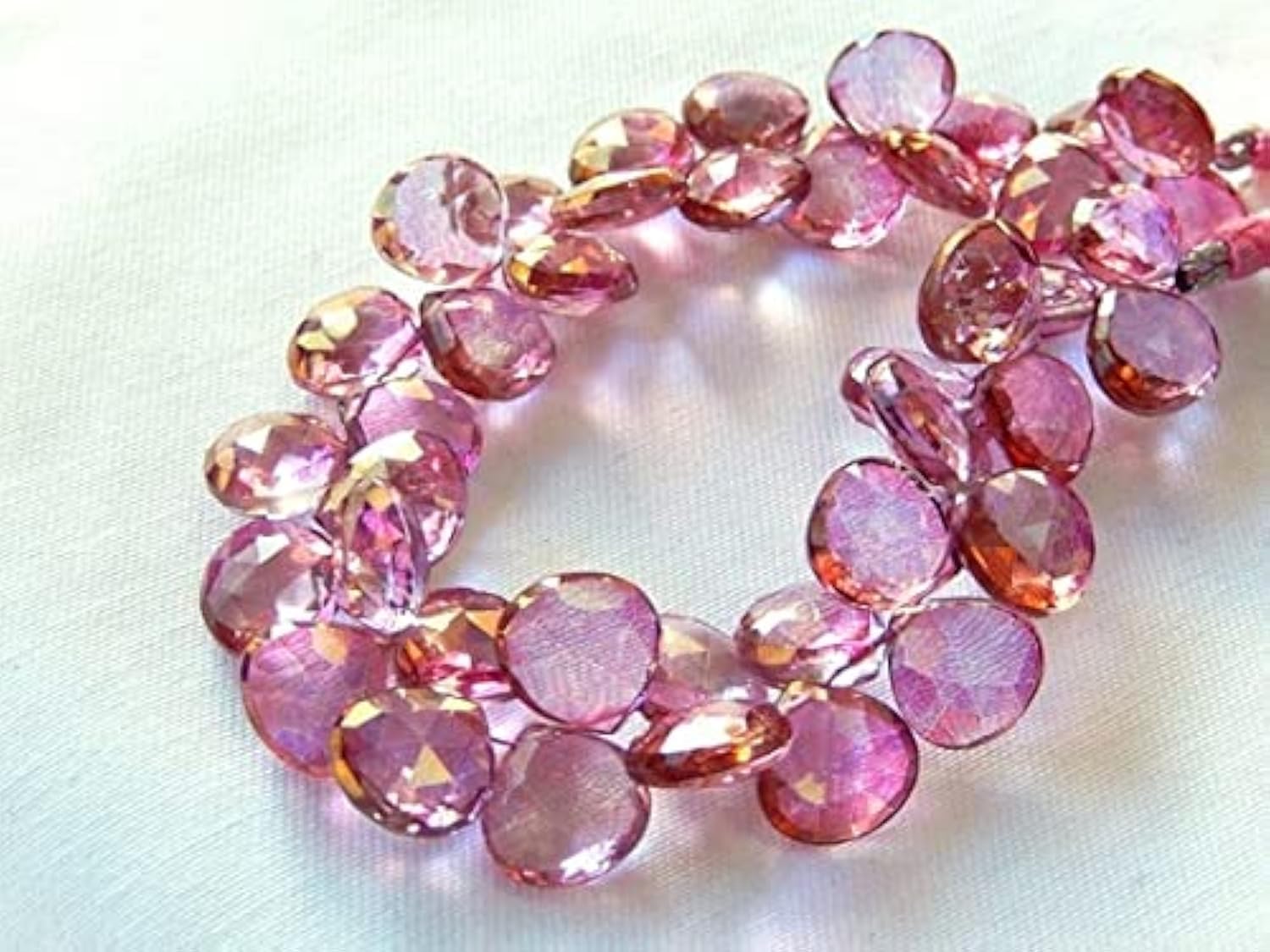 Quartz rose mystique facetté 11mm en cœur pour création joaillière haut de gamme
