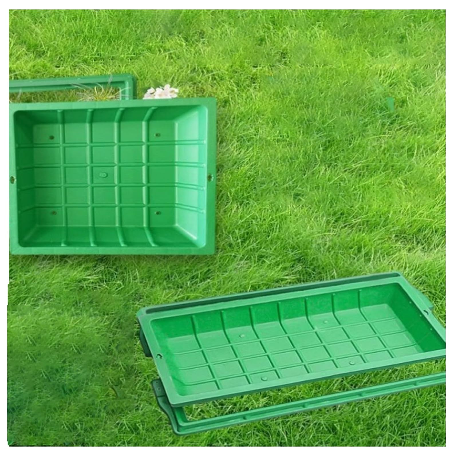Couvercle de bassin d'égout invisible à fleur de sol pour une allée de jardin épurée