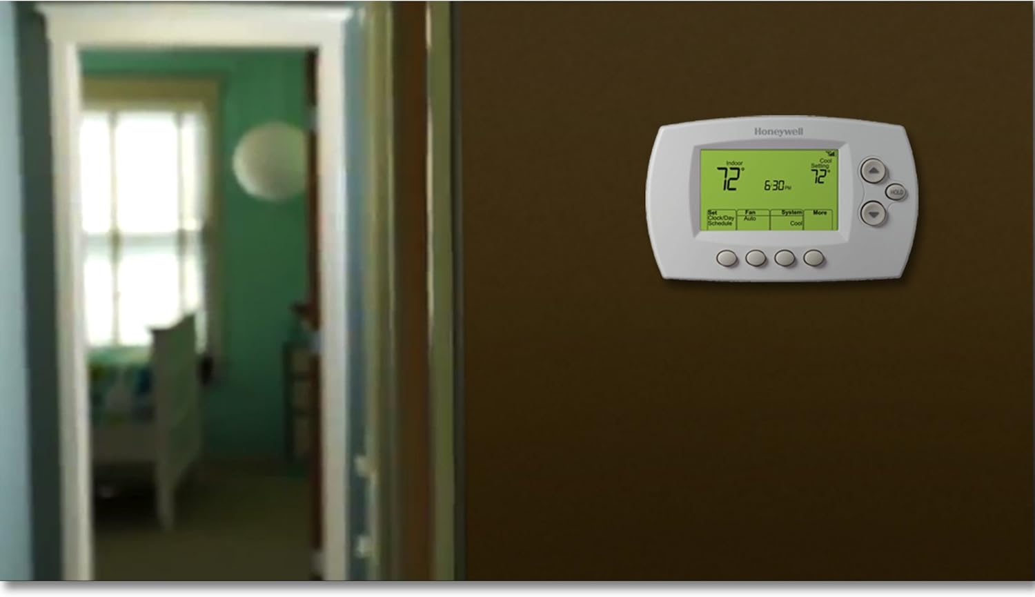 Honeywell Wi-Fi Programmable Thermostat mounted on a wall in a home setting.
